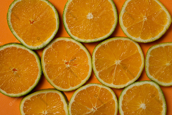 Fatias de Fruta Laranja em Fundo Laranja