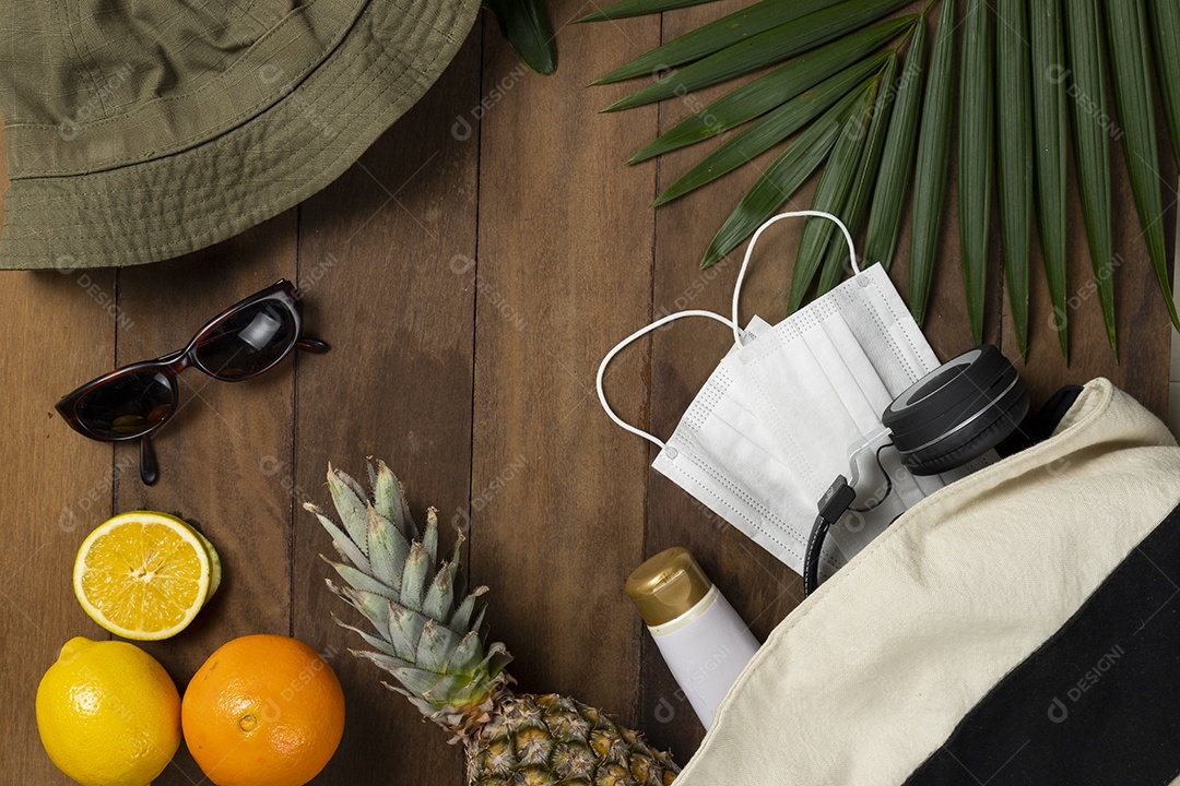 Mask, Sunglasses, Fruits and Leaves on a Wooden Background