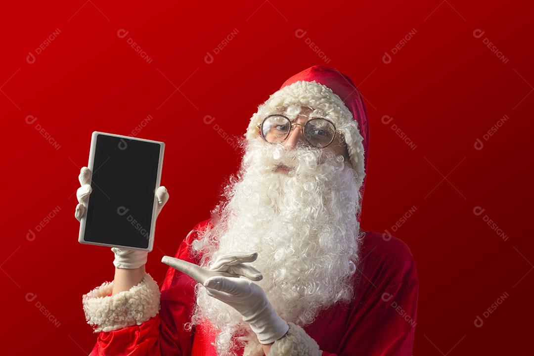 Papai Noel Apresentando e Apontando para Tablet Imagem JPG