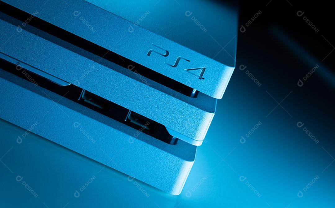 White Game Console Controller On A Blue Background Image JPG