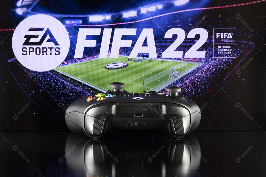 Controle do Xbox Com o Logotipo do Fifa 22 Ao Fundo Imagem JPG
