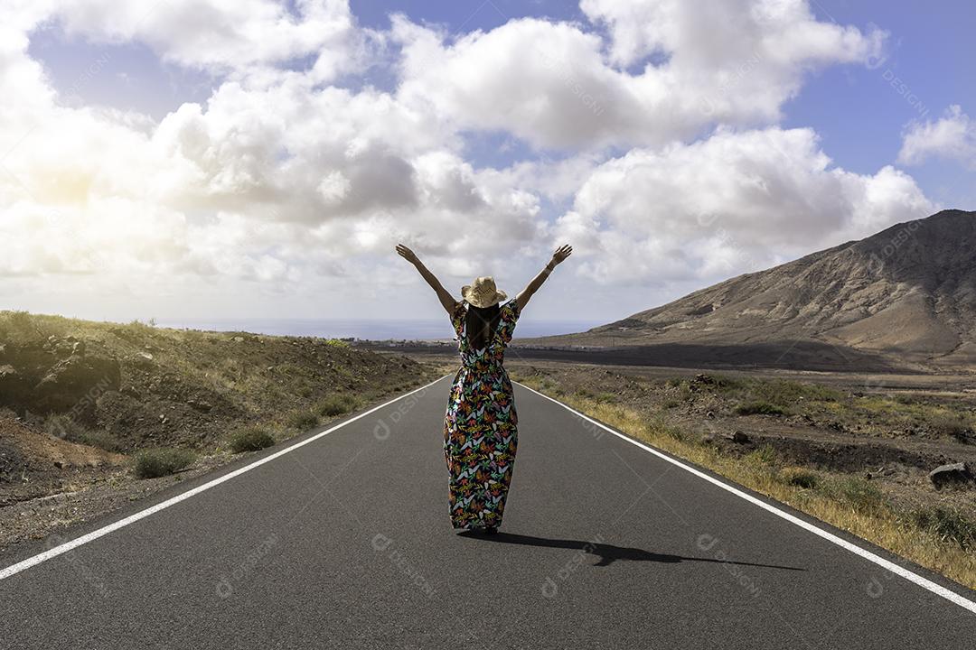 Woman On A Deserted Road In Arid Landscape JPG.jpg I