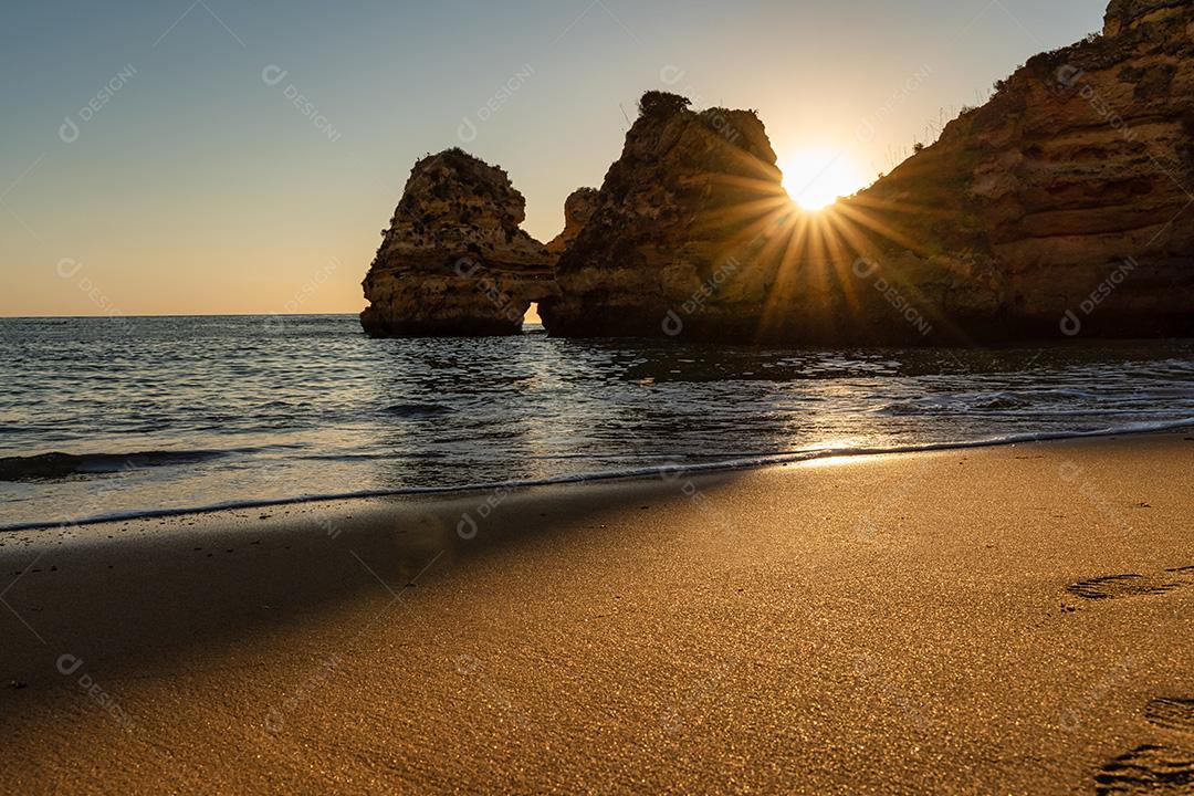 Praia Do Camilo Ao Nascer Do Sol Imagem JPG