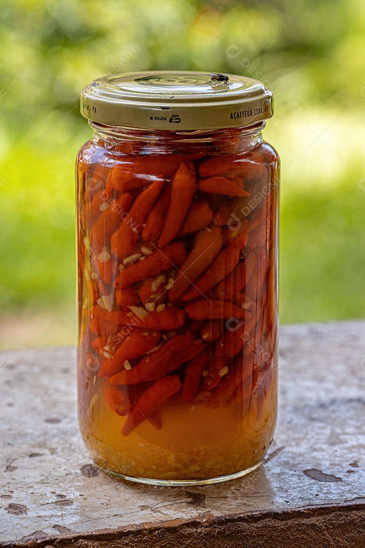 Conservas de Pimenta com Limão em um Recipiente de Vidro Imagem JPG