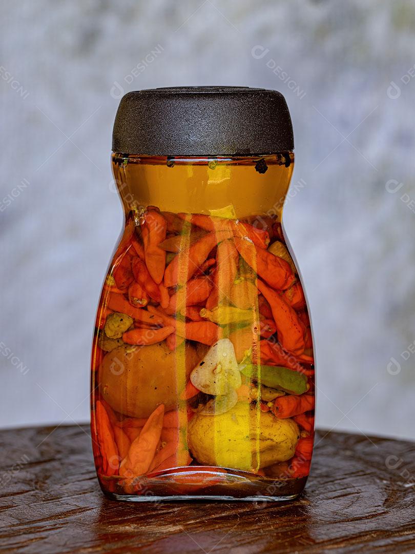 Pote de Conserva de Pimenta em Óleo com Pequi Imagem JPG