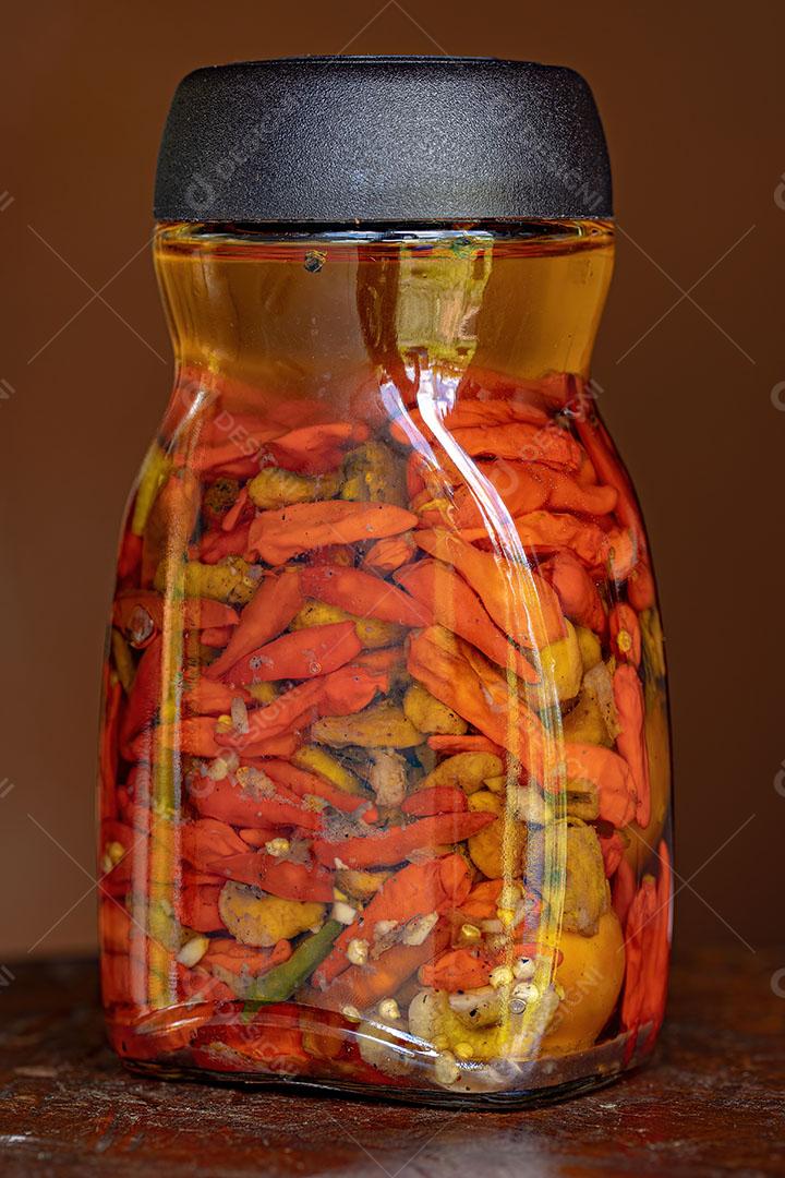 Pote de Conserva de Pimenta em Óleo com Pequi Imagem JPG