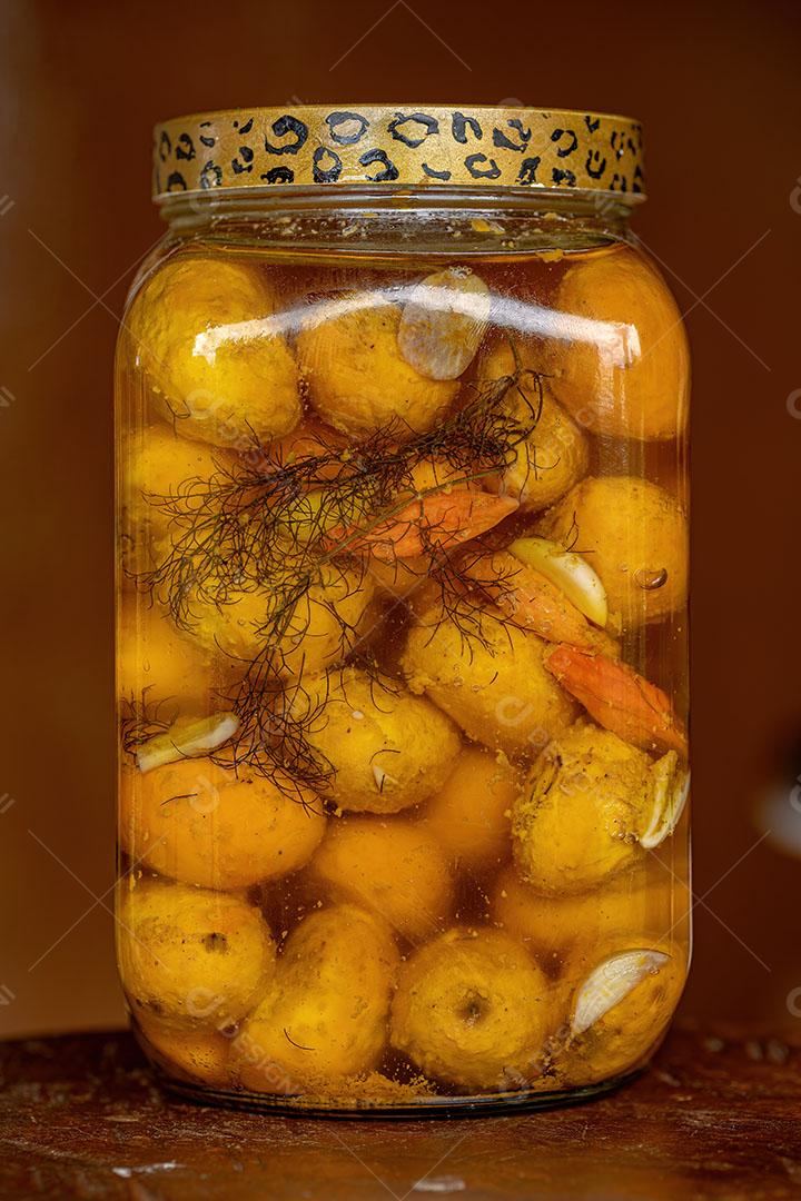 Pequi em Conserva em Óleo em Recipiente com Foco Seletivo Imagem JPG