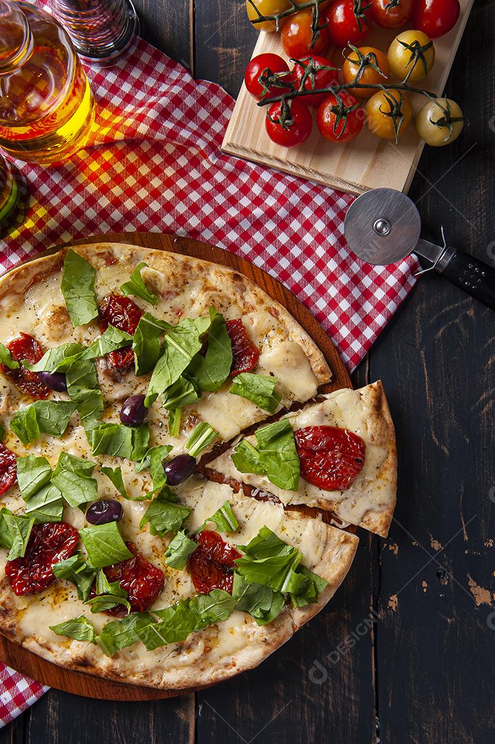 Um pedaço de Pizza com tomate seco JPG