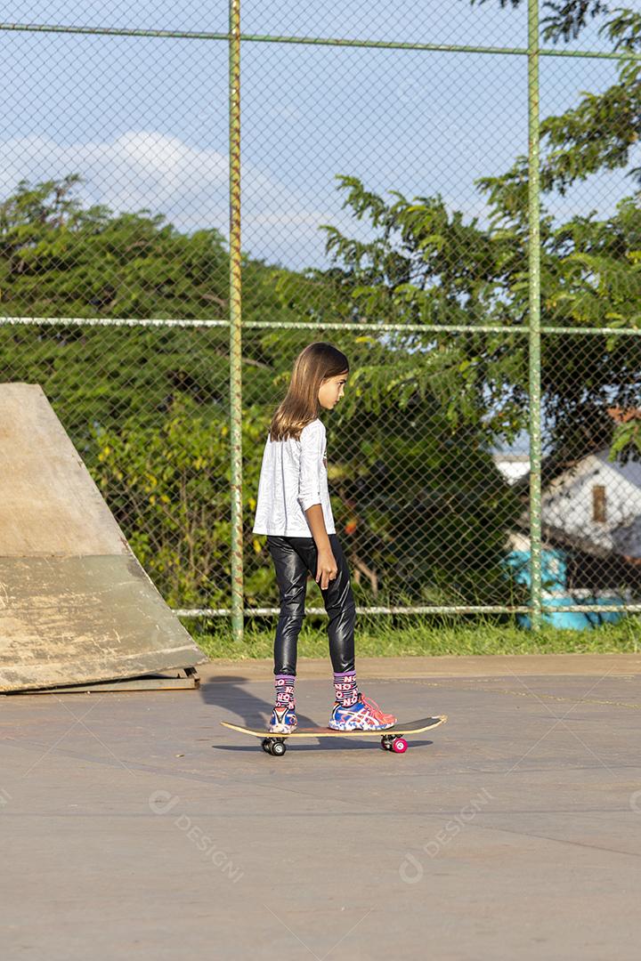 Girl skateboarding on a court Image JPG