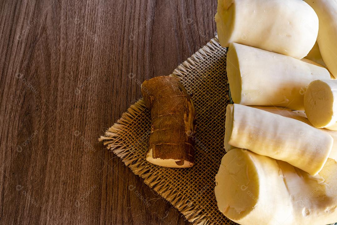 Cassava roots on a wooden table Image JPG