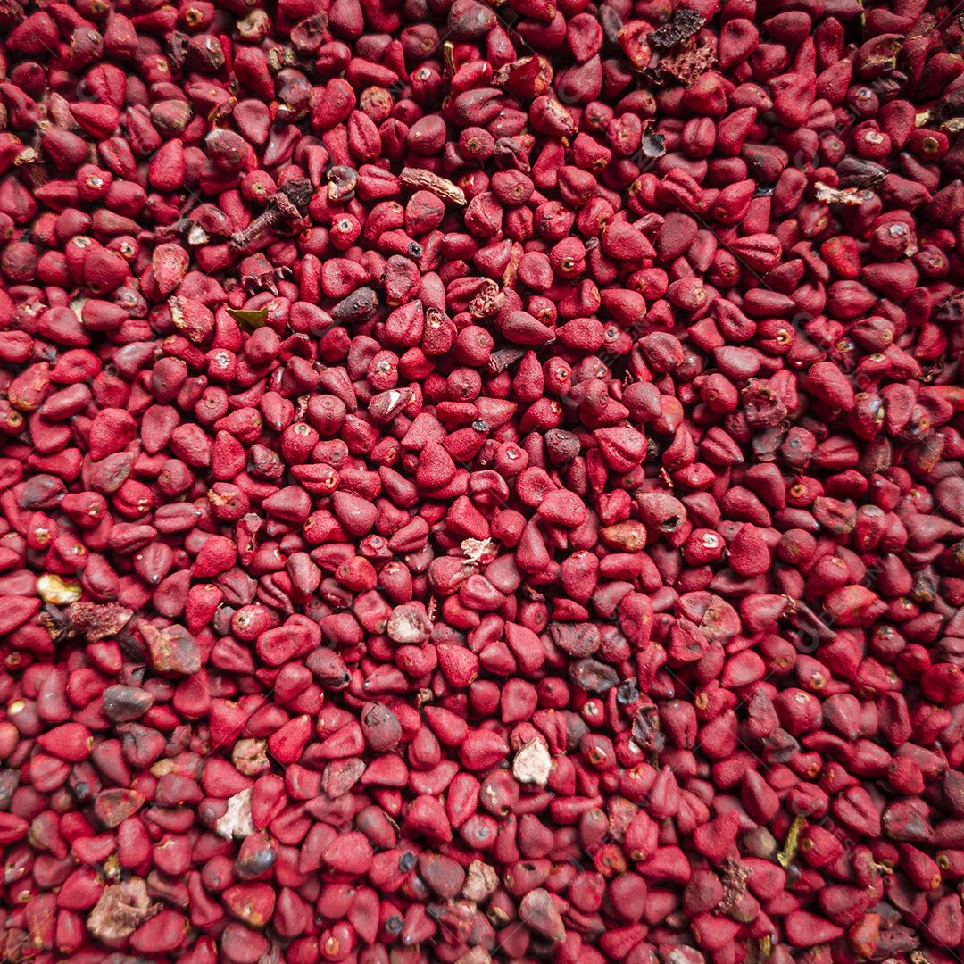 Grãos de urucum, fundo Urucum, textura Imagem JPG