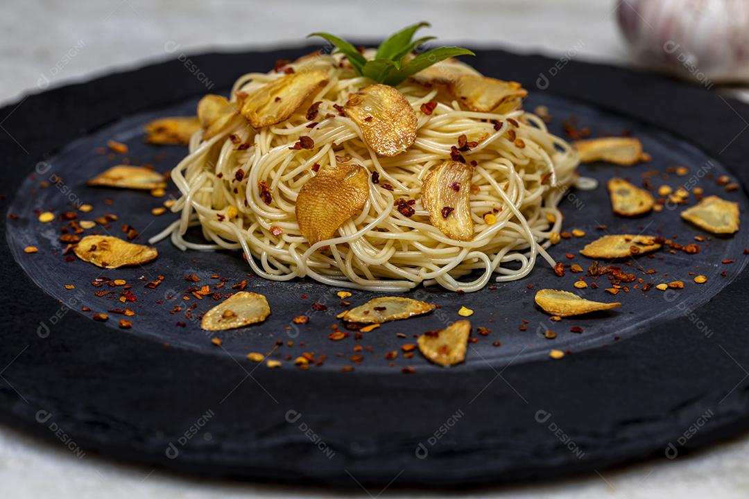 Spaghetti pasta with fried garlic and olive oil Image JPG