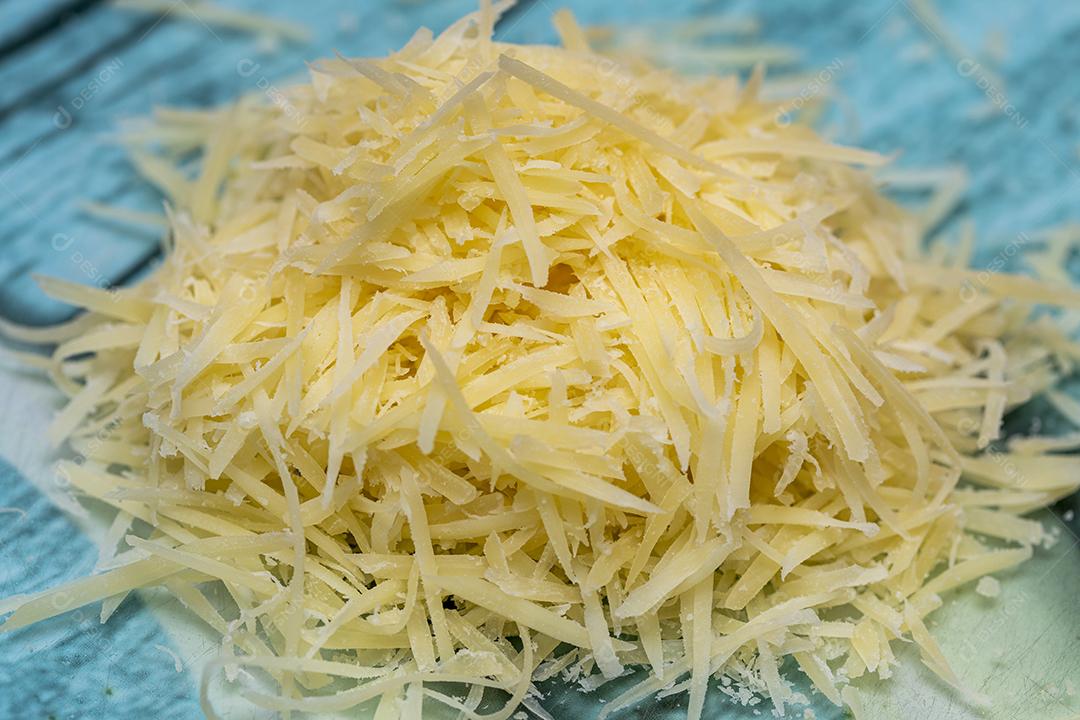 Queijo parmesão ralado na pedra Imagem JPG