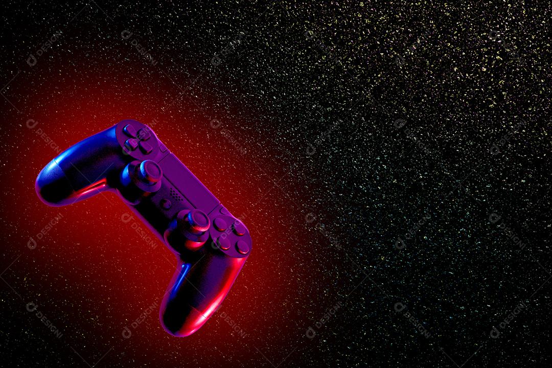 ilustração de joystick em fundo escuro com brilhos coloridos