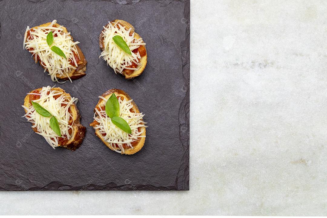 Bruschetta with Tomatoes, Basil and Parmesan Cheese on Wild Boar JPG