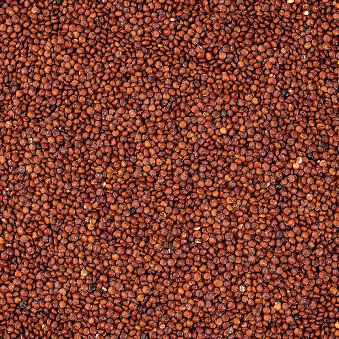 Vista superior, grãos de quinoa vermelho crus. Pano de fundo alimentar JPG