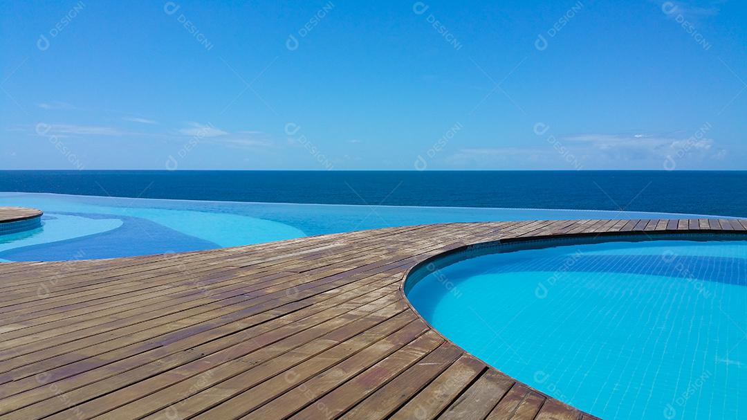 Infinity pool overlooking the sea and blue sky