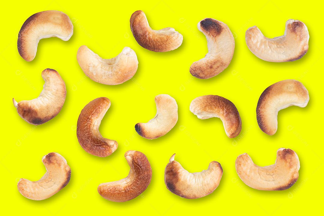 Cashew pattern on a yellow background. Nuts creative layout