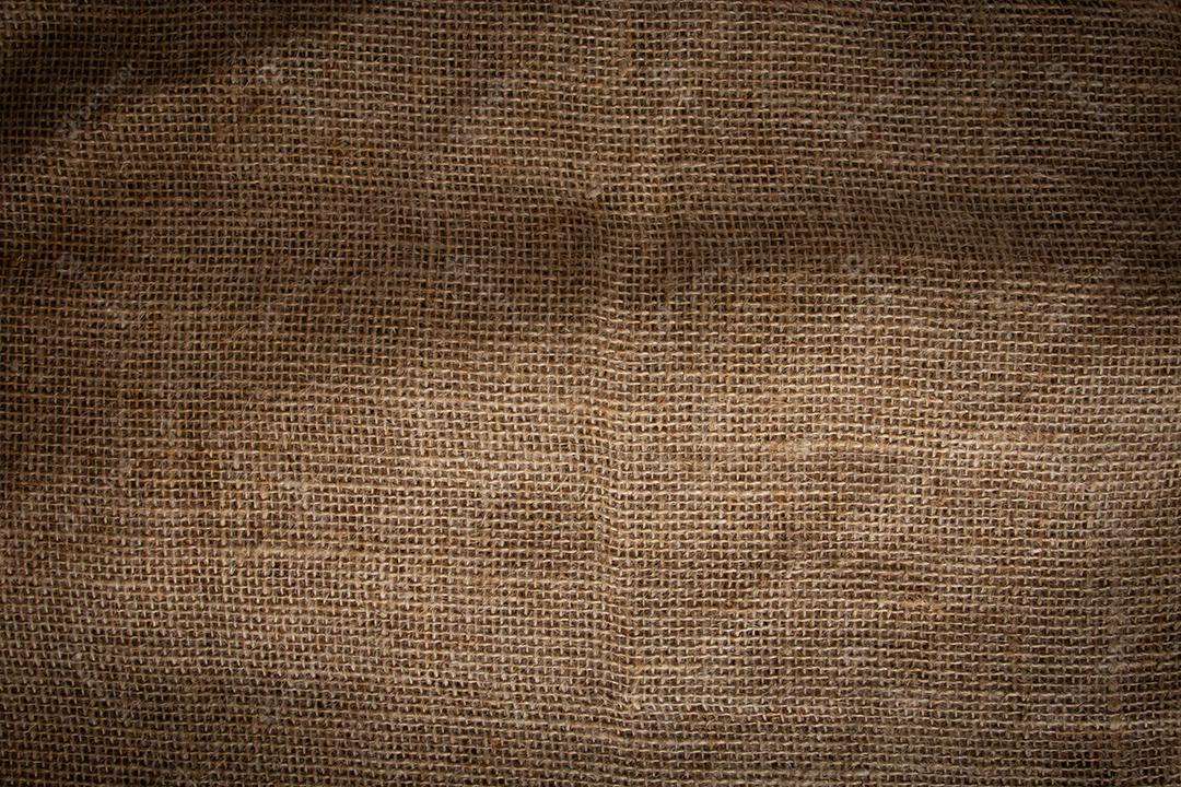 Fundo com textura de fibra de juta bege.