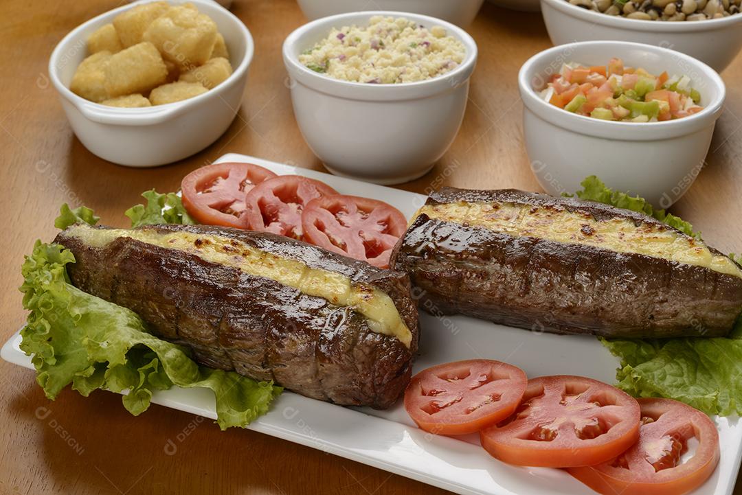 Carne de sol acompanhamentos. Carne de sol, bife salgado, prato típico do nordeste brasileiro.