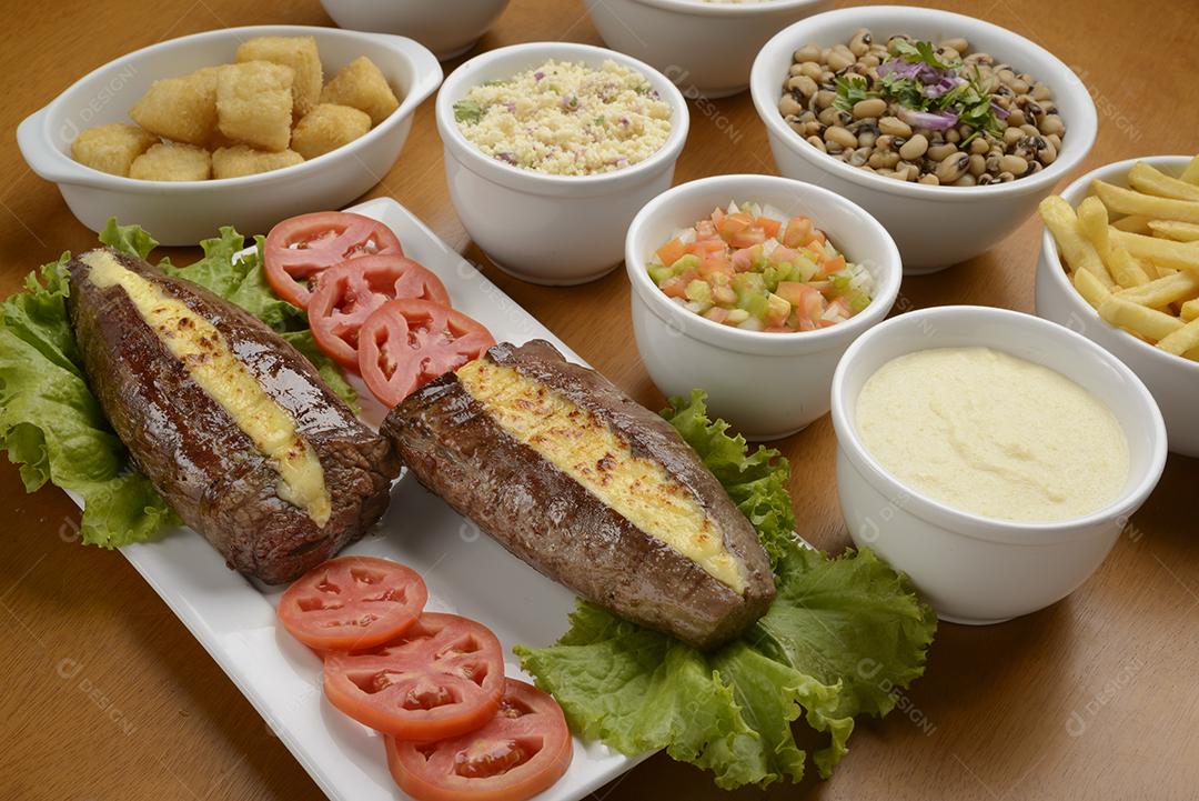 Carne de sol acompanhamentos. Carne de sol, bife salgado, prato típico do nordeste brasileiro.