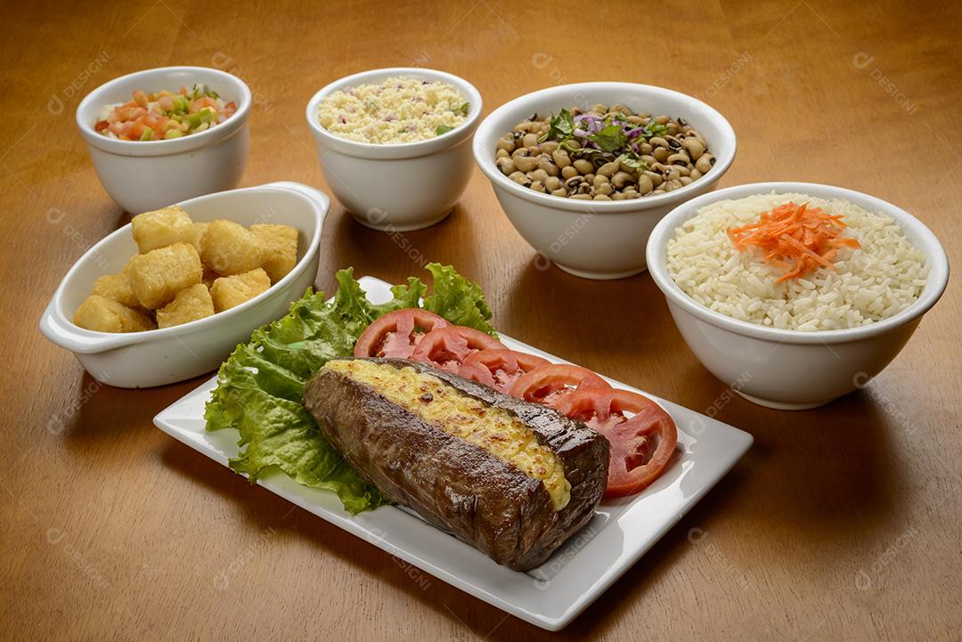 Carne de sol acompanhamentos. Carne de sol, bife salgado, prato típico do nordeste brasileiro.