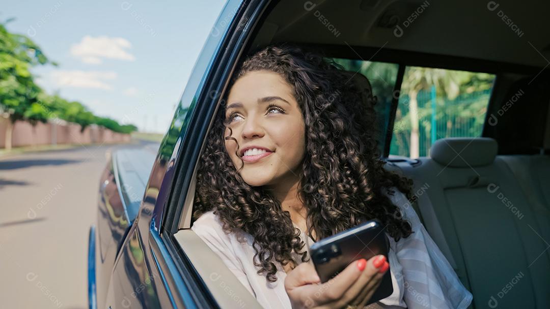 Beautiful latina tourist traveling in a taxi and reescrita