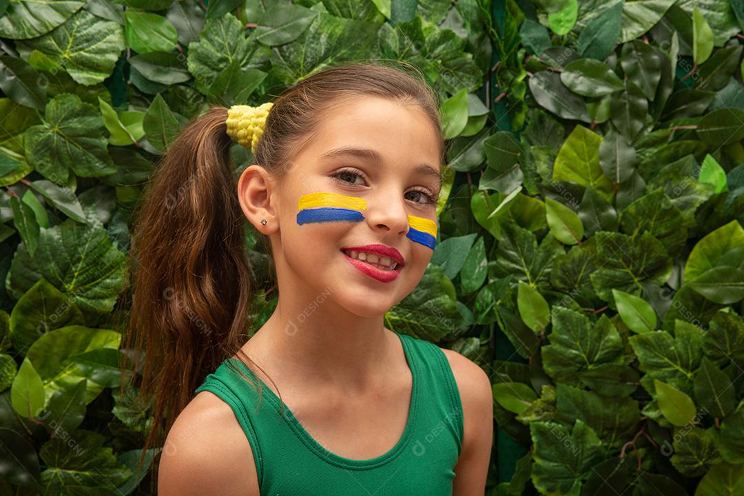 Soccer supporter, Brazilian team. World Cup. Beautiful little girl rooting for her team