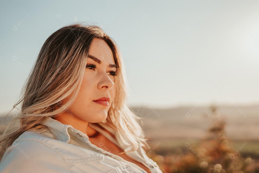 Beautiful young blonde latina woman outdoors portrait. Hairstyle