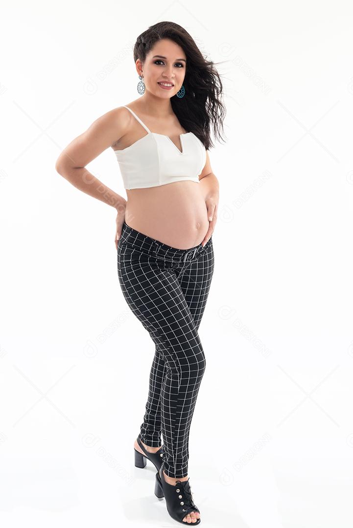 Happy smiling pregnant woman touching her belly isolated