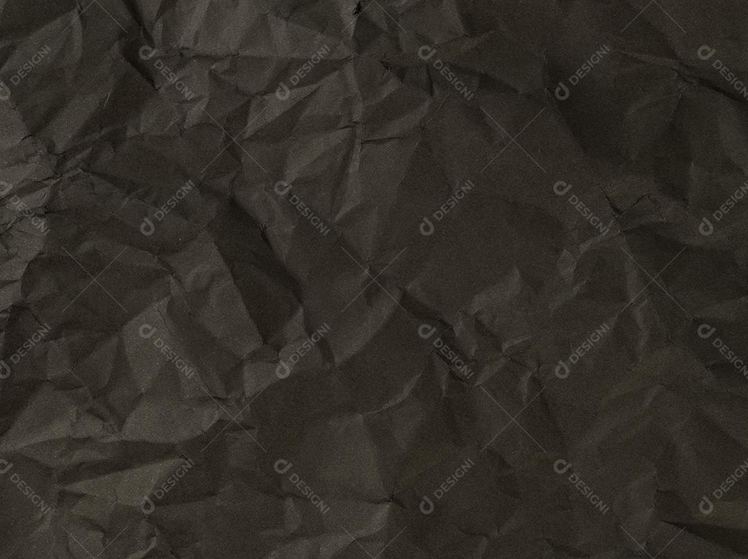 Folha enrugada de papel preto. Pano de fundo texturizado