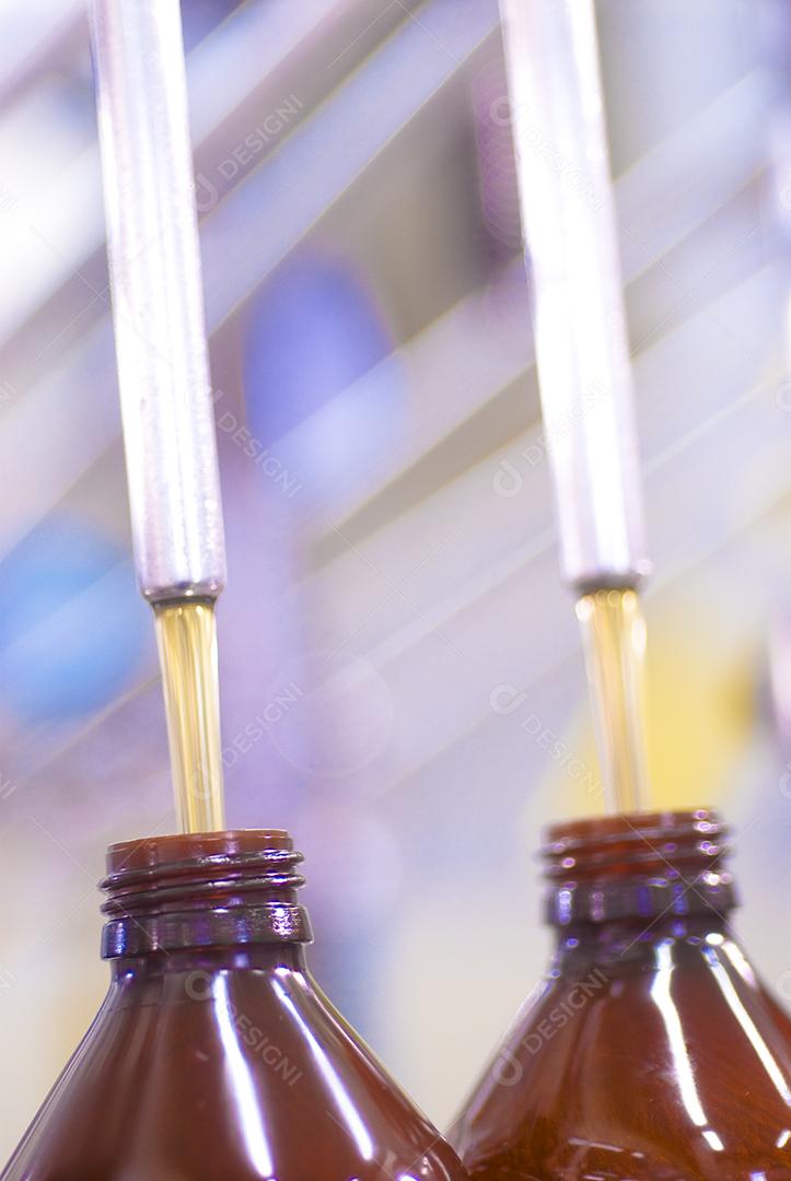 Glass bottle with syrup on everyday background