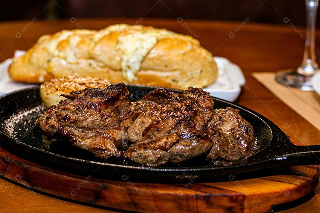 Roasted juicy meat grilled on the barbecue.