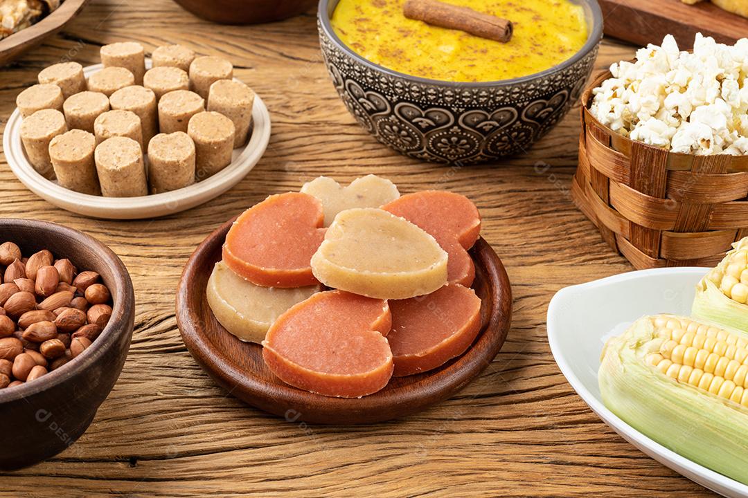 Typical Brazilian June festival food on wooden table. Festa Junina