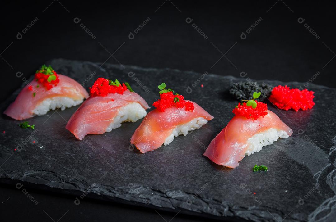 Perfect sushi, traditional Japanese cuisine. Delicious tuna kiguiri with capelin roe caviar
