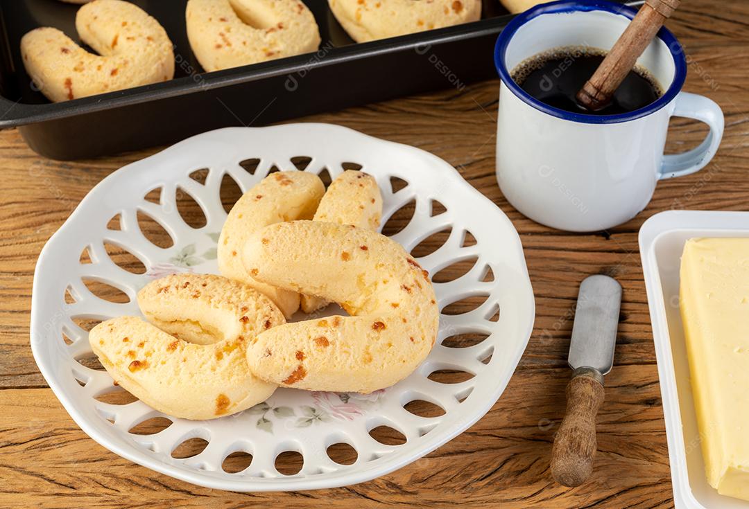 Chipas, typical South American cheese bread on a plate with butter.
