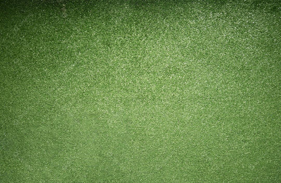 Vista superior da textura de grama verde artificial para futebol