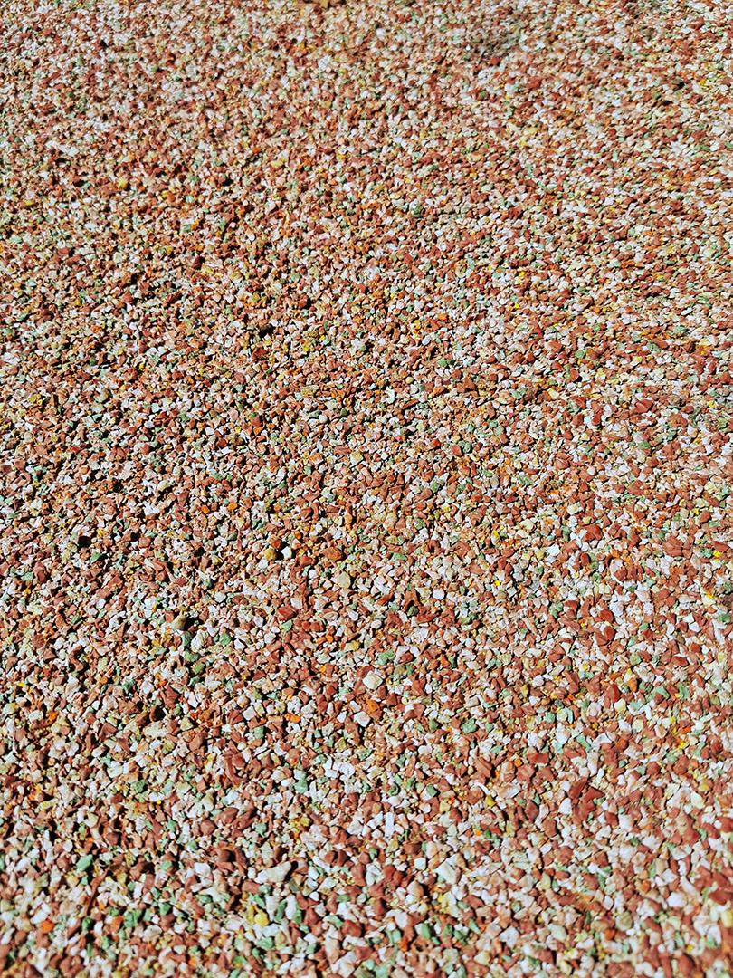 Textura de pequenas rochas de borracha coloridas..