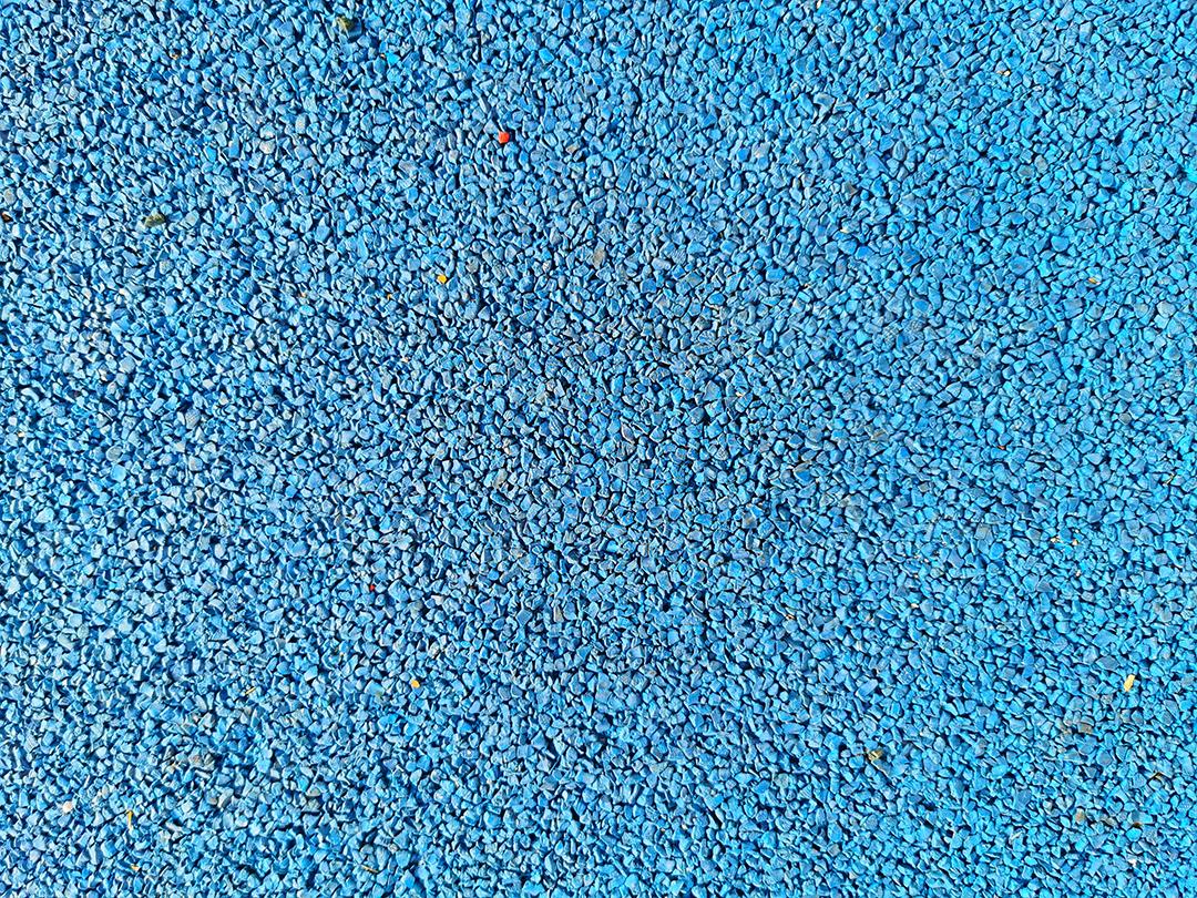Textura de pequenas rochas de borracha azul..