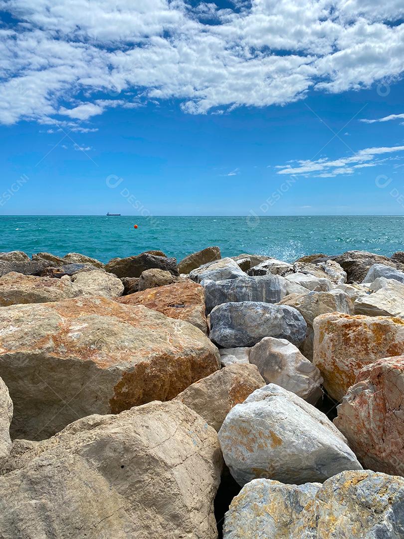 View of the sea hitting the cliffs in the sea of Malaga Malaga in summer.