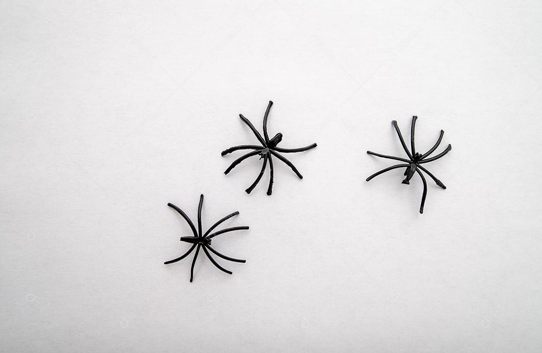 Set of plastic spiders on white background for Halloween cards.