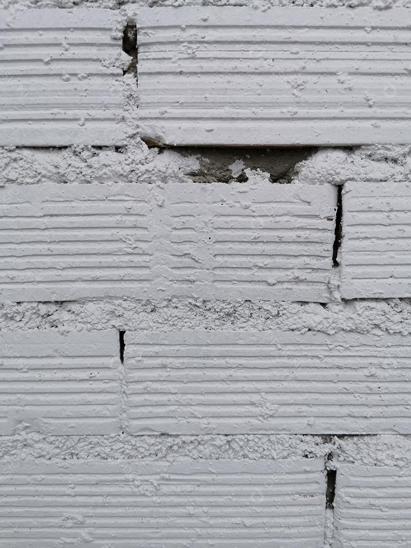 Beautiful texture of white bricks together with cement.