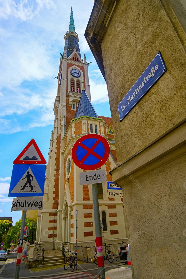 View of church and street signs in the streets of Vienna, Austria.
