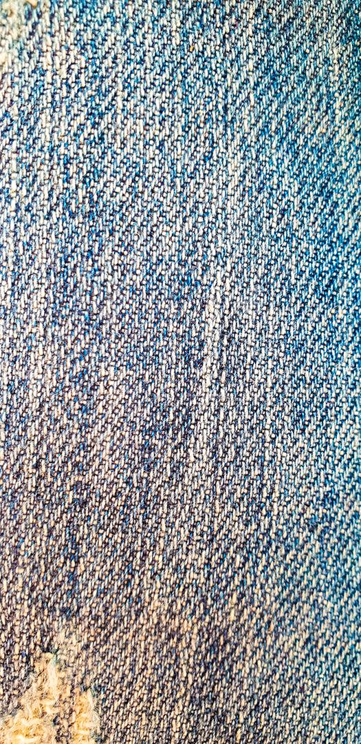 Feche a vista da textura de jeans azul.