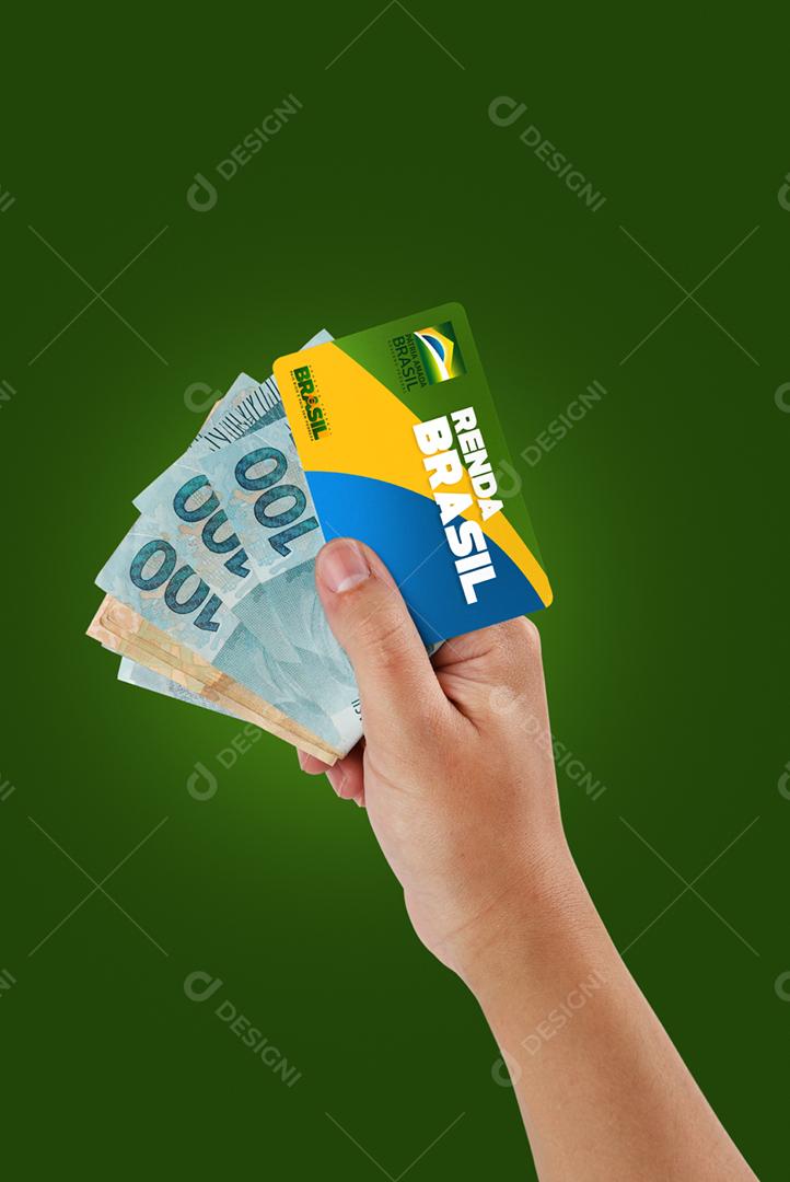Curitiba, Paraná, Brasil, 06 de setembro de 2020. Mão brasileira segurando cartão e dinheiro do novo programa de ajuda popular chamado Renda Brasil. Novo auxílio emergencial e bolsa família. Fundo da bandeira.