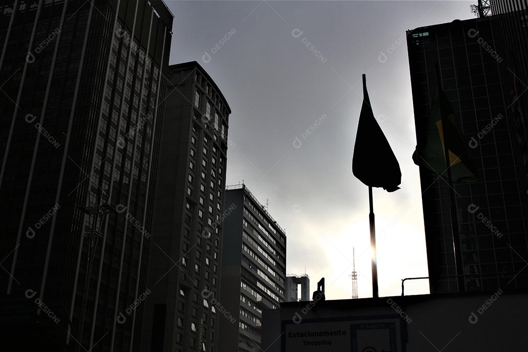 Flags of parents flying over high buildings