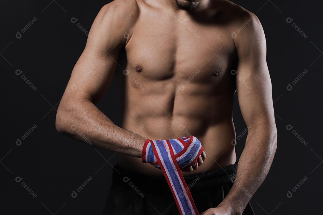 male fighter hand with bandages. Fighter clenched fists before a fight or training in a sports gym
