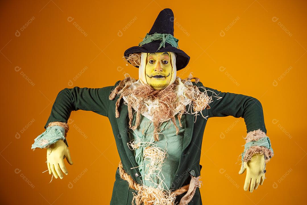 photo of scarecrow character from festa junina on yellow background