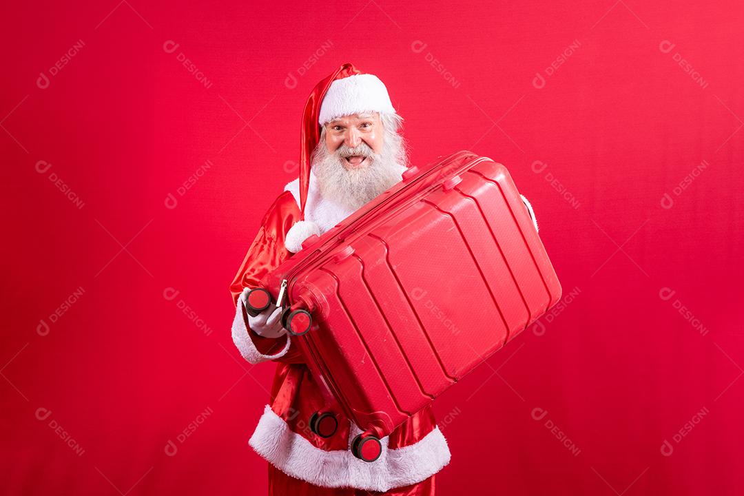 Papai Noel com sua mala. Conceito de viagens de ano novo. Papai Noel
