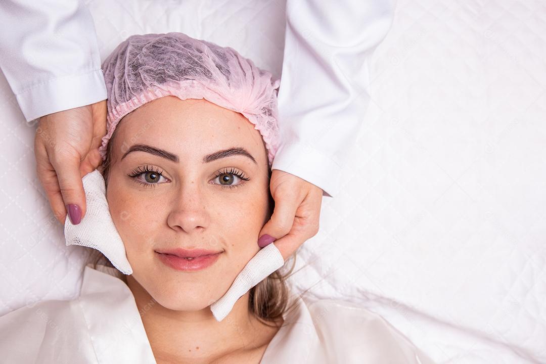 Young woman with thick eyebrows and perfect skin